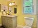 Inviting bathroom features a vanity with lots of storage, a stylish mirror, and ample natural light at 9305 Harps Mill Ct, Charlotte, NC 28270