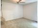 Neutral bedroom featuring a ceiling fan, a built in access panel, and carpeted floors at 9305 Harps Mill Ct, Charlotte, NC 28270
