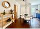 Dining area with hardwood floors and a round glass table with seating for four at 9305 Harps Mill Ct, Charlotte, NC 28270