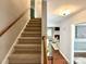 Inviting foyer featuring a staircase and an open view into the living room at 9305 Harps Mill Ct, Charlotte, NC 28270