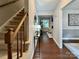 Inviting foyer with a staircase and decor that leads into a brightly lit living space at 9305 Harps Mill Ct, Charlotte, NC 28270