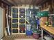 Organized storage area featuring shelving with multiple bins, and bikes hung on the wall at 9305 Harps Mill Ct, Charlotte, NC 28270