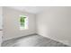 Bright bedroom with new gray flooring, white trim and freshly painted walls at 1017 W Fisher St, Salisbury, NC 28144