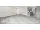 Spacious living area with sleek gray floors and stainless steel kitchen appliances at 1017 W Fisher St, Salisbury, NC 28144