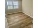 Bedroom showcasing laminate floors and a window with natural light at 10416 Audubon Ridge Dr # 4, Cornelius, NC 28031