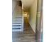 Inviting entryway showcasing beautiful floors and a staircase at 10416 Audubon Ridge Dr # 4, Cornelius, NC 28031