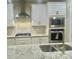 Modern kitchen featuring stainless steel appliances and granite counters at 10416 Audubon Ridge Dr # 4, Cornelius, NC 28031