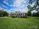Charming brick home with a well-maintained front yard, offering great curb appeal at 1050 Old Peachland Rd, Marshville, NC 28103
