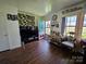 Inviting living room featuring wood flooring, natural light, and tastefully decorated interior at 1050 Old Peachland Rd, Marshville, NC 28103