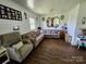 Spacious living room with wood flooring, neutral colors, comfortable seating and bright interior at 1050 Old Peachland Rd, Marshville, NC 28103