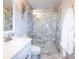Bathroom with a glass-enclosed shower featuring stylish tile work and updated fixtures at 11123 Waxberry Dr, Charlotte, NC 29277