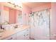 Bathroom featuring vanity with sink, mirror, shower, and tub at 11123 Waxberry Dr, Charlotte, NC 29277