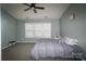 Bedroom with a ceiling fan, large window, and comfortable bedding at 11123 Waxberry Dr, Charlotte, NC 29277