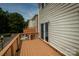 Wooden deck providing an open outdoor area, featuring a sliding glass door to the house at 11123 Waxberry Dr, Charlotte, NC 29277