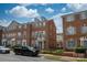 Well-maintained brick townhome featuring stylish architectural details and a quaint balcony at 11123 Waxberry Dr, Charlotte, NC 29277