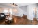 Bright living room with hardwood floors, staircase, and easy access to other rooms at 11123 Waxberry Dr, Charlotte, NC 29277