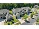 An aerial view shows a neighborhood featuring well-manicured lawns, mature trees and sidewalks at 11313 Limehurst Pl, Charlotte, NC 28278