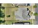 Aerial view of a house showcasing its roof, backyard with lush grass, and fencing at 11313 Limehurst Pl, Charlotte, NC 28278