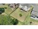 Aerial view of backyard, showing the landscaping, covered patio, lawn and fence at 11313 Limehurst Pl, Charlotte, NC 28278