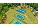 Overhead shot of the basketball and tennis courts surrounded by trees and walking paths at 11313 Limehurst Pl, Charlotte, NC 28278