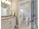 Clean bathroom with a granite countertop, white cabinets, and access to a tub-shower combo, perfect for Gathering use at 11313 Limehurst Pl, Charlotte, NC 28278