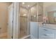 Contemporary bathroom featuring a glass-enclosed shower, white vanity, and modern fixtures at 11313 Limehurst Pl, Charlotte, NC 28278