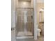 Modern bathroom features a glass-enclosed shower, contemporary fixtures, and neutral tile at 11313 Limehurst Pl, Charlotte, NC 28278