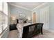 Cozy bedroom with soft lighting, neutral decor, and a comfortable bed, a relaxing retreat at 11313 Limehurst Pl, Charlotte, NC 28278