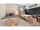 Shared ' bedroom featuring matching beds, a black accent wall, and a fun, playful decor at 11313 Limehurst Pl, Charlotte, NC 28278