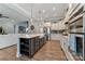 Modern kitchen features a large island and stainless steel appliances, perfect for cooking and entertaining at 11313 Limehurst Pl, Charlotte, NC 28278