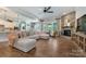 Spacious living room features a cozy fireplace and comfortable seating for entertaining guests at 11313 Limehurst Pl, Charlotte, NC 28278