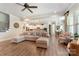 Inviting living room showcases hardwood floors, neutral tones, and open floor plan to dining and kitchen at 11313 Limehurst Pl, Charlotte, NC 28278
