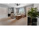 Cozy living room featuring a plush sectional sofa, wooden coffee table, and neutral tones for a relaxing atmosphere at 11313 Limehurst Pl, Charlotte, NC 28278