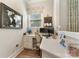Functional home office featuring built-in desk, ample storage, and natural light at 11313 Limehurst Pl, Charlotte, NC 28278
