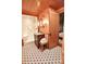 Retro bathroom featuring a glass shower, floral wallpaper, and patterned tile floors at 1137 Queens W Rd, Charlotte, NC 28207