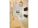 Bright bathroom with soaking tub, marble countertop, and decorative chandelier lighting at 1137 Queens W Rd, Charlotte, NC 28207