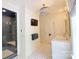 Bright bathroom with shower, marble countertop, double sinks, and decorative chandelier lighting at 1137 Queens W Rd, Charlotte, NC 28207