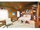 Unique bedroom featuring wood paneling, decorative elements, and comfortable furnishings at 1137 Queens W Rd, Charlotte, NC 28207