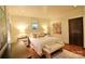 Bright bedroom with hardwood floors, neutral walls, and a comfortable king-sized bed at 1137 Queens W Rd, Charlotte, NC 28207