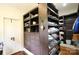 Custom closet shelving system and drawers provide ample storage in this home at 1137 Queens W Rd, Charlotte, NC 28207