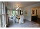 Bright dining room featuring white walls, hardwood table, and french doors to the patio at 1137 Queens W Rd, Charlotte, NC 28207