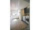 Well lit laundry room with white washer and dryer and built in storage at 1137 Queens W Rd, Charlotte, NC 28207