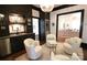 Stylish lounge area with a mini bar, comfortable seating, and modern decor in dark, neutral tones at 1137 Queens W Rd, Charlotte, NC 28207