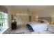 Spacious main bedroom with a king bed, large windows with natural light, and closets at 1137 Queens W Rd, Charlotte, NC 28207