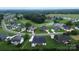Aerial view showing property in relation to the neighborhood and nearby golf course and water feature at 115 Augusta Ln, Shelby, NC 28150