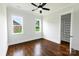 Bedroom featuring hardwood floors, window views, and a walk-in closet at 115 Augusta Ln, Shelby, NC 28150