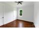 Bedroom featuring hardwood floors, a window view, and a closet with shelving at 115 Augusta Ln, Shelby, NC 28150