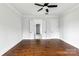 Spacious bedroom featuring hardwood floors, a ceiling fan, and access to a walk-in closet at 115 Augusta Ln, Shelby, NC 28150