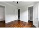 Bedroom featuring hardwood floors and an ensuite bathroom with frameless shower and walk-in closet at 115 Augusta Ln, Shelby, NC 28150