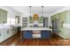 Spacious kitchen with green cabinets, stainless steel appliances, and a large island at 115 Augusta Ln, Shelby, NC 28150